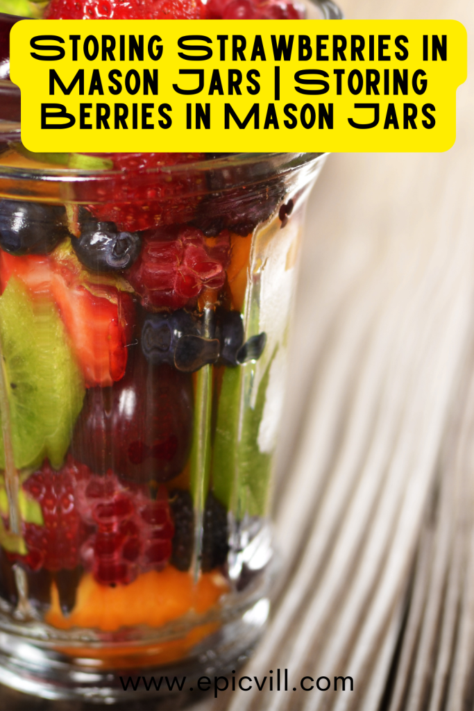 Filling The Mason Jars With Strawberries